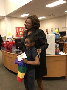 Volunteer with Child at Event