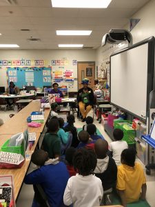 Woman reading to Classroom