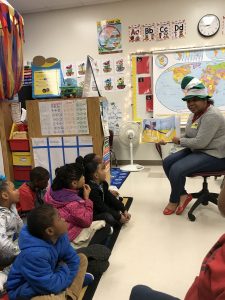 Woman reading to Classroom