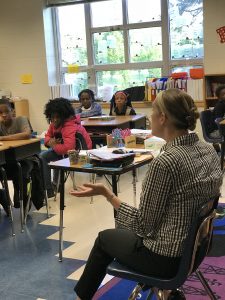 Woman reading to Classroom